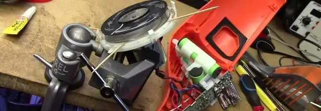 Vacuum cleaner repair parts and tools on a workbench in Saint Louis, MO